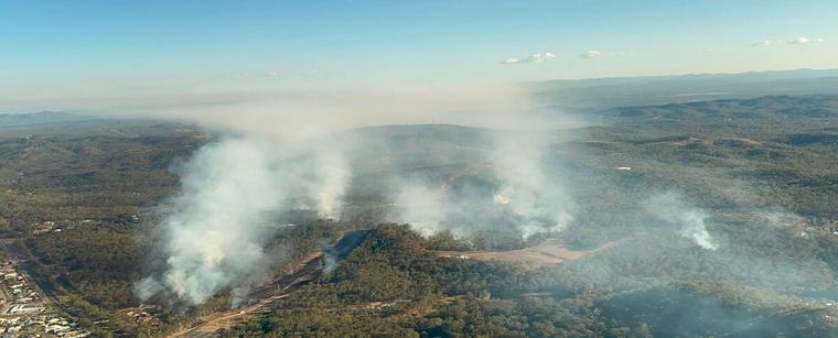 Spring showers forecast for Queensland as dozens of fires burn