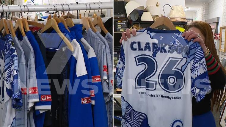 Alastair Clarkson spotted making huge Vinnies donation with bags of Kangaroos apparel